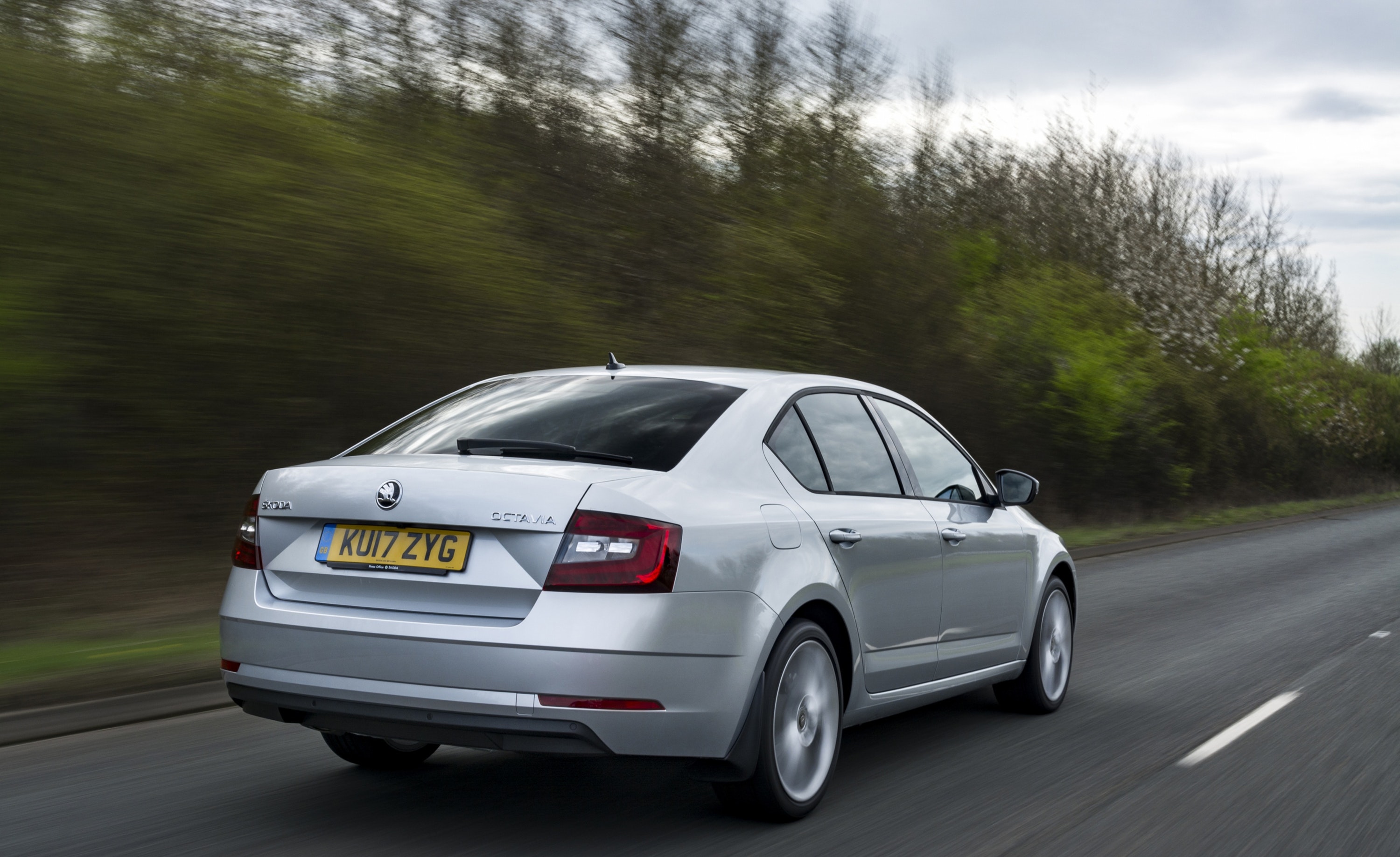 Silver Skoda Octavia driving away from you